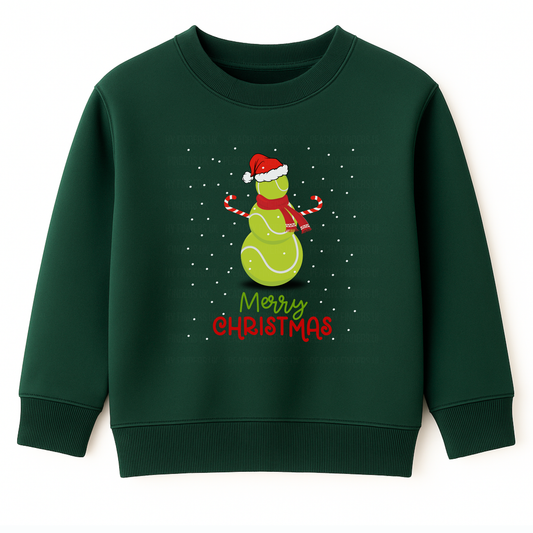 Kids dark green Christmas sweatshirt with a cute tennis ball snowman wearing a Santa hat and scarf, surrounded by falling snow and the text ‘Merry Christmas’ in festive red and green lettering.