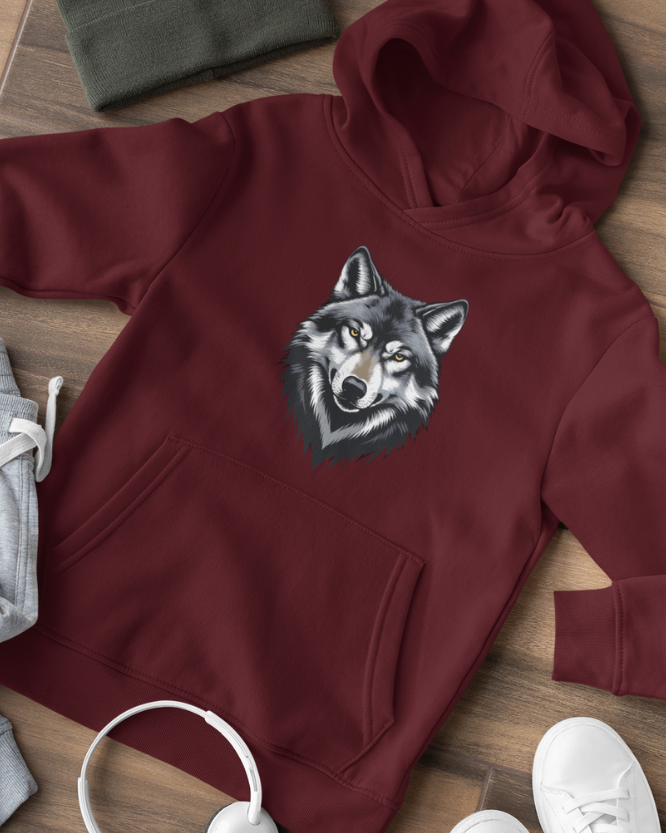 Burgundy kids hoodie with wolf face graphic, flat lay outfit styling with joggers and trainers on wooden background