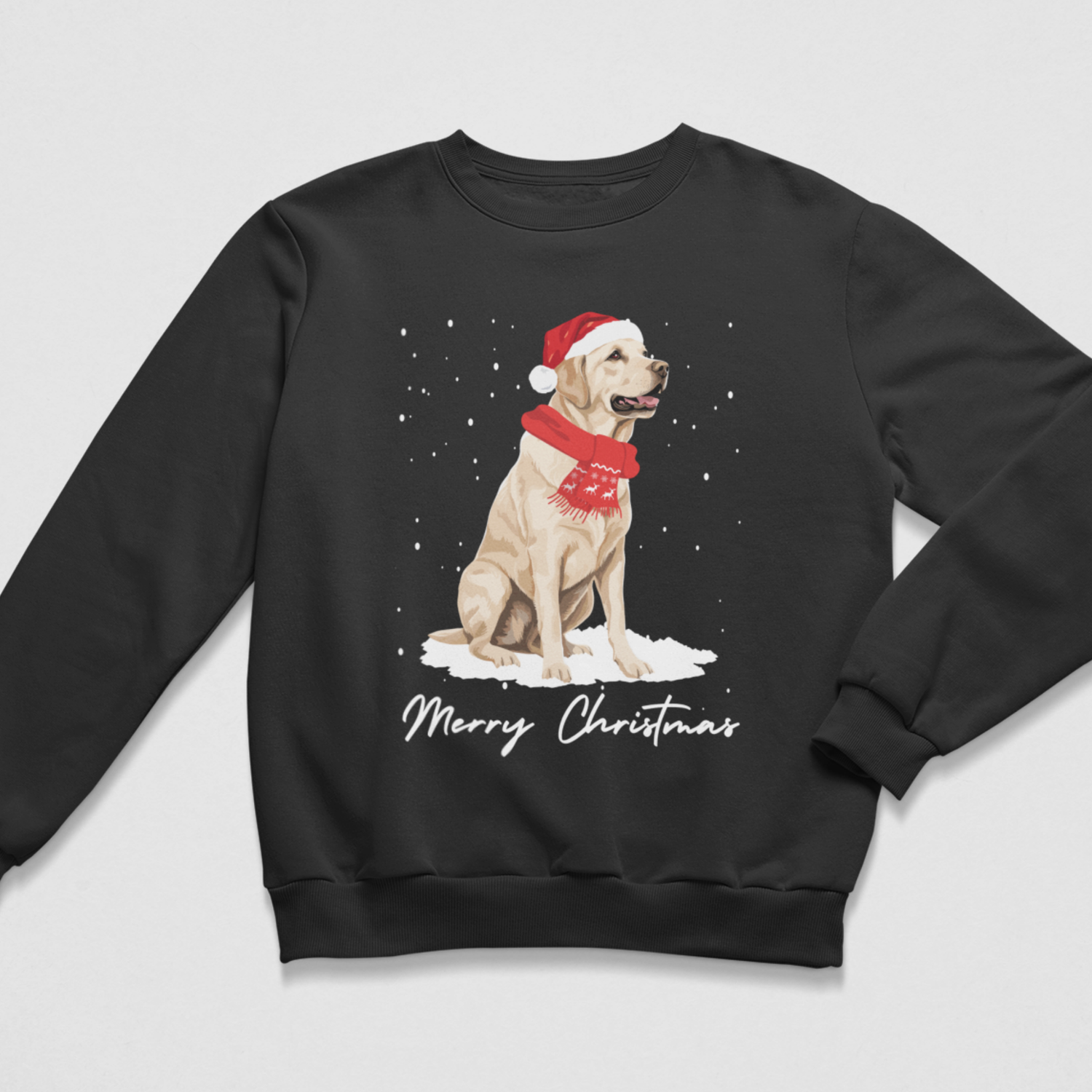 A black crewneck sweatshirt featuring a graphic of a yellow Labrador wearing a red Santa hat and red scarf, sitting in the snow with 'Merry Christmas' written below, displayed on a light grey background.