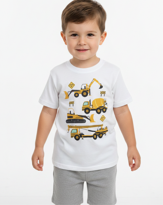 Little boy wearing white kids construction vehicle t-shirt with digger, dump truck and crane graphic front view