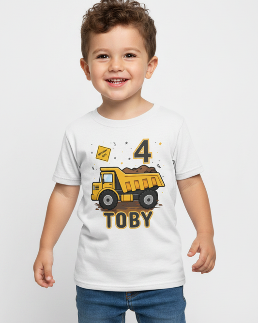Smiling child wearing personalised dump truck birthday t-shirt with name Toby and number 4 front view