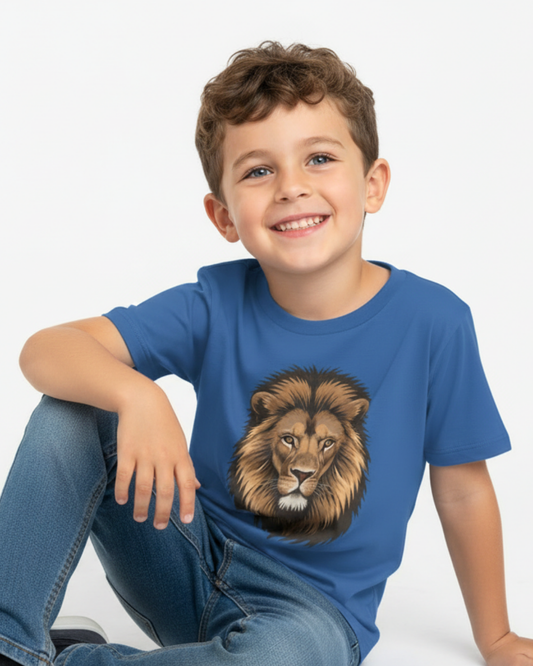 Smiling boy in blue lion face t-shirt sitting casually, kids animal graphic tee outfit