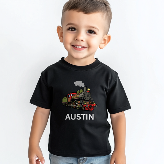 Toddler boy wearing a custom name black T-shirt with a colourful steam train design.