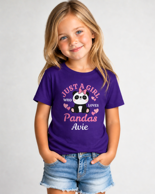 Little girl wearing personalised purple panda t-shirt with “Just a Girl Who Loves Pandas” print and name Avie, styled with denim shorts, studio background