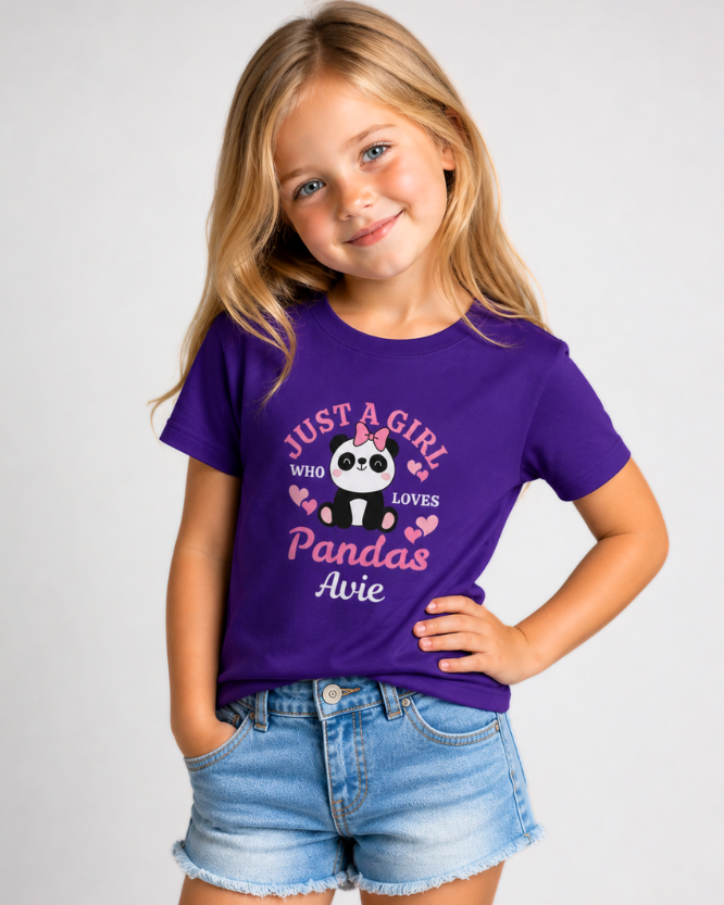 Kids personalised panda t-shirt in purple with cute panda graphic and custom name Avie, modelled by young girl with denim shorts, clean studio shot