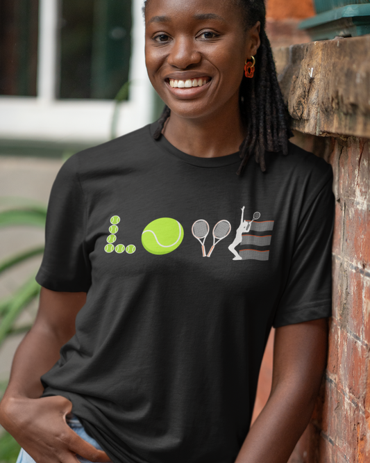 Smiling woman wearing a black LOVE Tennis graphic t-shirt with tennis ball, racket and net design spelling LOVE.