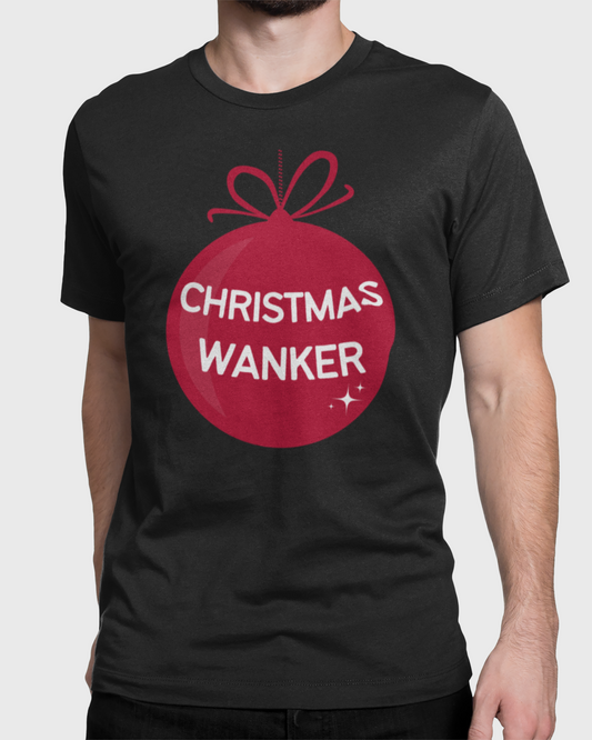 A man wearing a black t-shirt with a red Christmas ornament graphic that reads 'CHRISTMAS WANKER' in white text, shown against a light gray background.