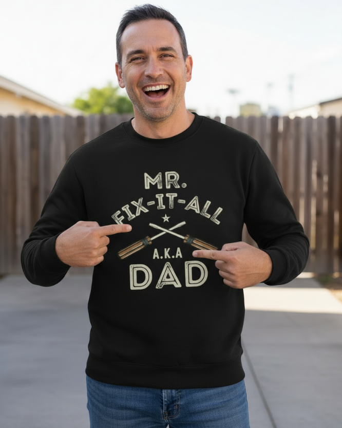 Man wearing Mr Fix It All A.K.A Dad sweatshirt outdoors pointing to graphic