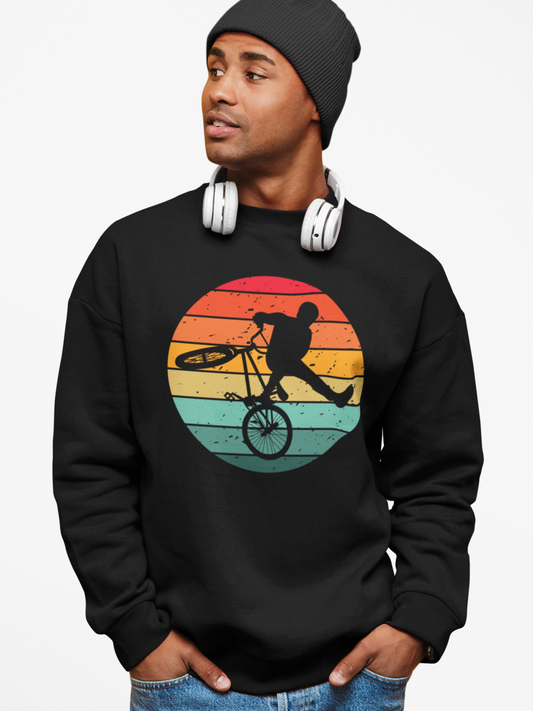 Man wearing black retro BMX sweatshirt with circular vintage bike graphic.