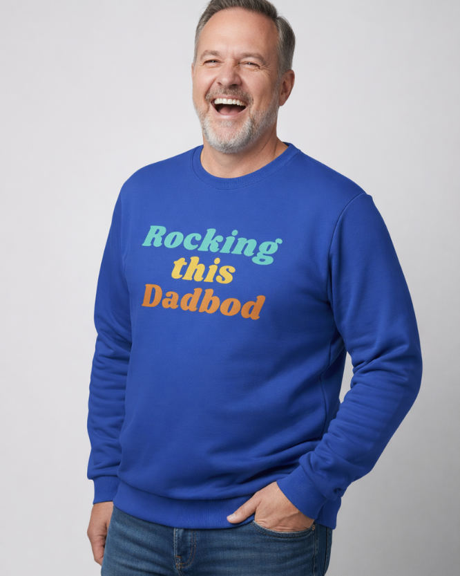 Happy father wearing Rocking This Dadbod sweatshirt laughing lifestyle photo