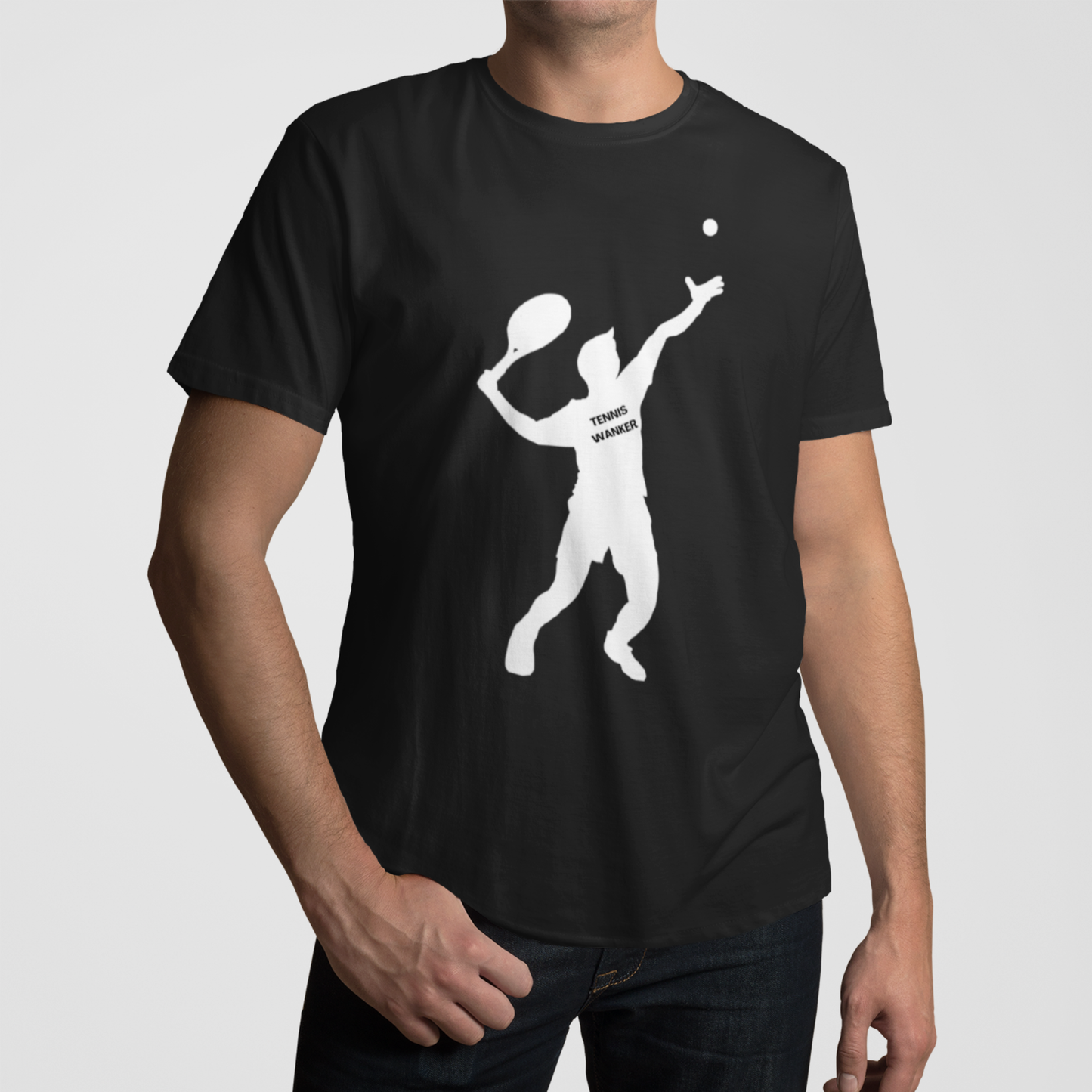 Man wearing a black “Tennis Wanker” T-shirt featuring a bold white silhouette of a tennis player serving a ball.
