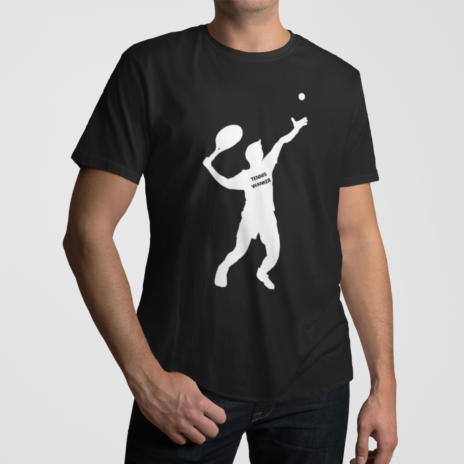 Man wearing a black “Tennis Wanker” T-shirt featuring a bold white silhouette of a tennis player serving a ball.