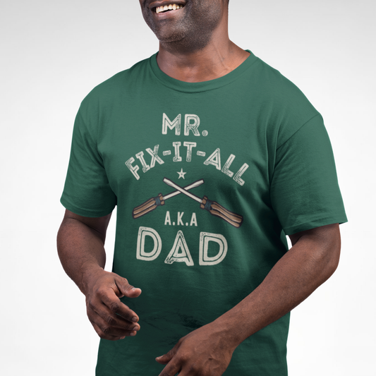 Man wearing a green “Mr. Fix-It A.K.A Dad” t-shirt with crossed screwdrivers vintage-style graphic.