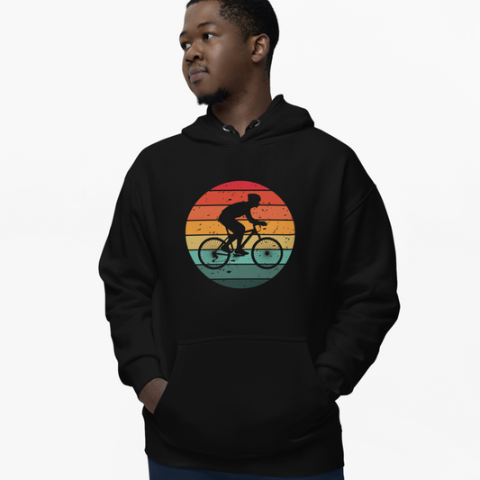 Man wearing a black hoodie with a colourful cyclist graphic on a white background