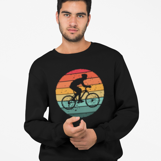 Man wearing a black sweatshirt with a colorful bicycle graphic on a white background