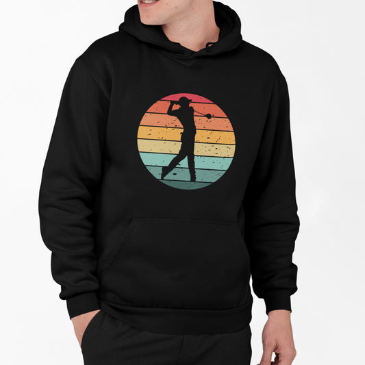 Man wearing a black pullover hoodie with vintage sunset golf swing silhouette graphic on the front