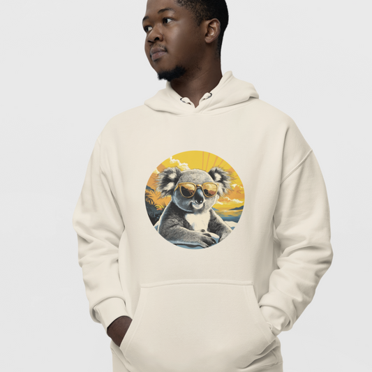 man wearing cream hoodie with cool koala sunglasses graphic and sunset background