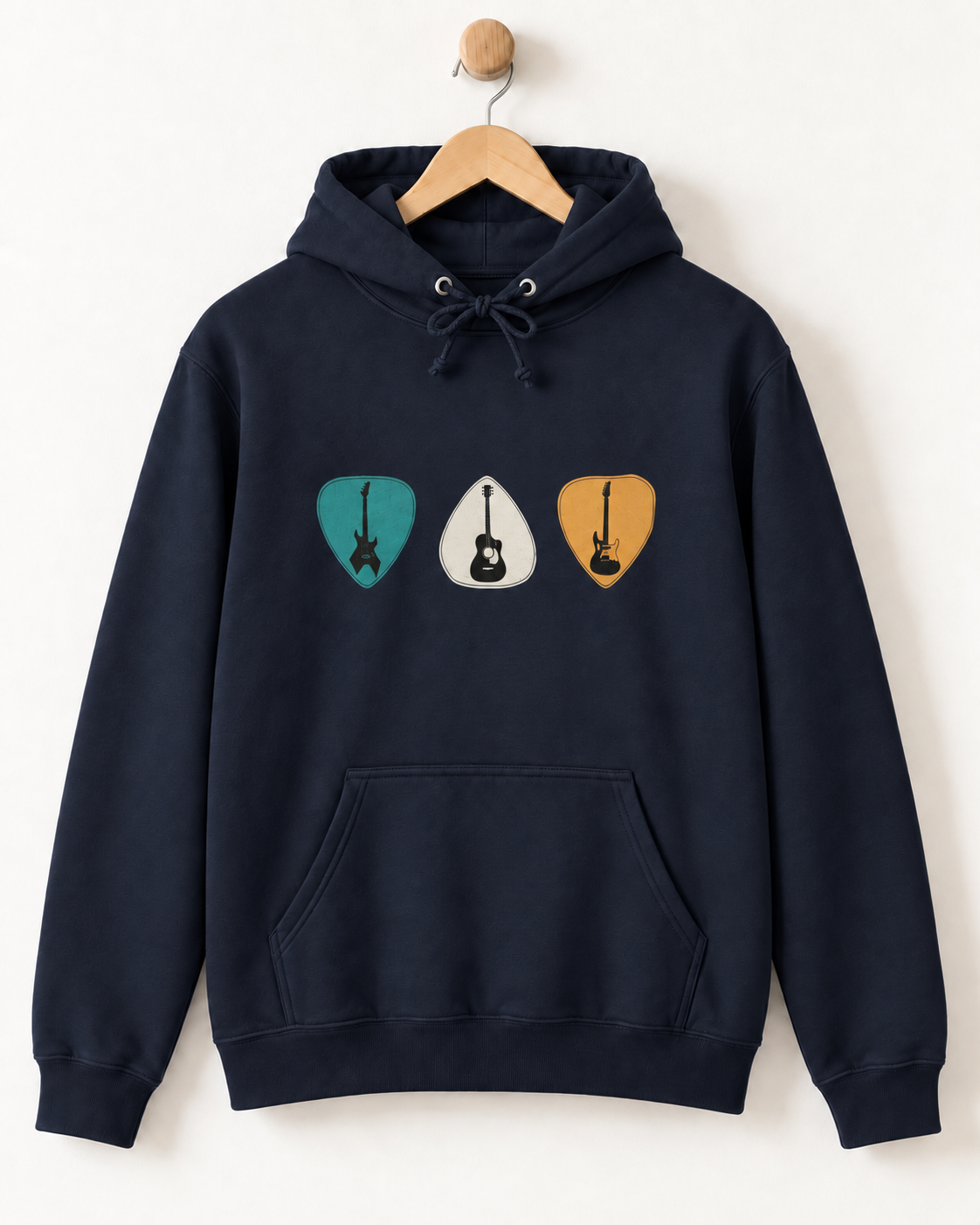 Navy guitar plectrums hoodie displayed on a natural wooden hanger against a light neutral wall.