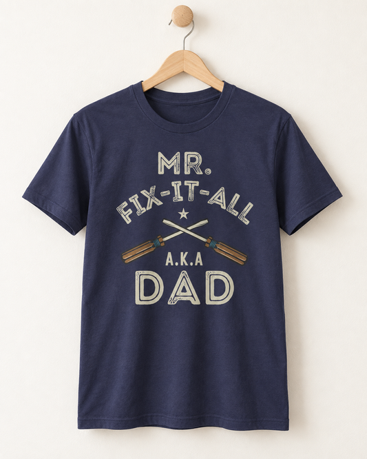 Navy Mr Fix-It-All AKA Dad T-shirt with crossed screwdrivers displayed on a wooden hanger
