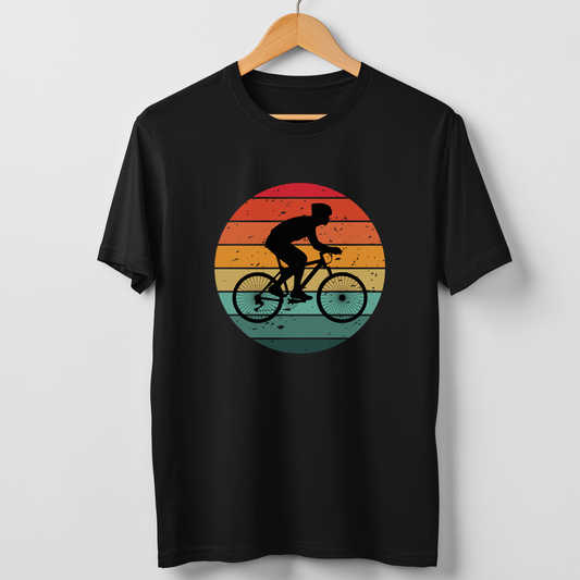 Men's black t-shirt with retro-style cyclist silhouette printed on a sunset gradient background on wooden hanger