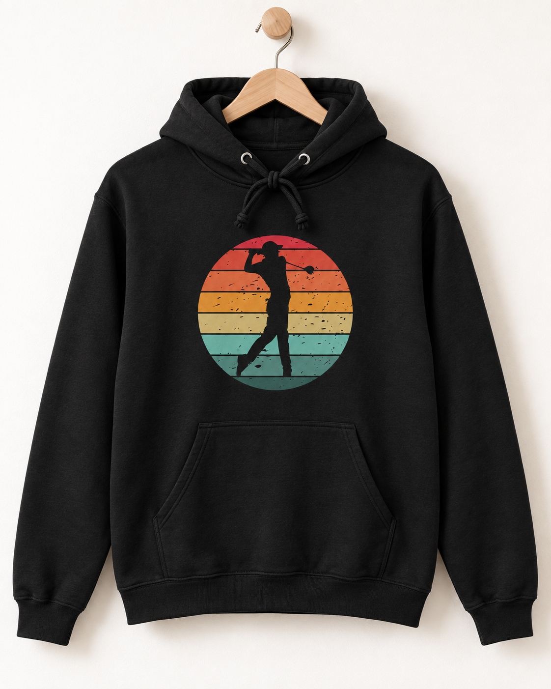 Black men’s golf hoodie with a retro sunset golfer graphic displayed on a wooden hanger.