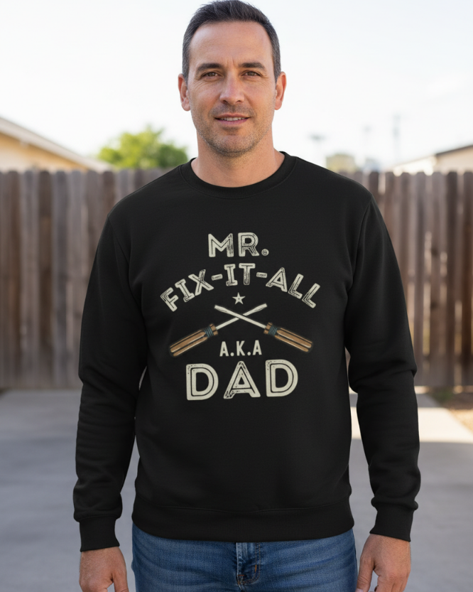 Man wearing Mr Fix It All A.K.A Dad graphic print black sweatshirt outdoors