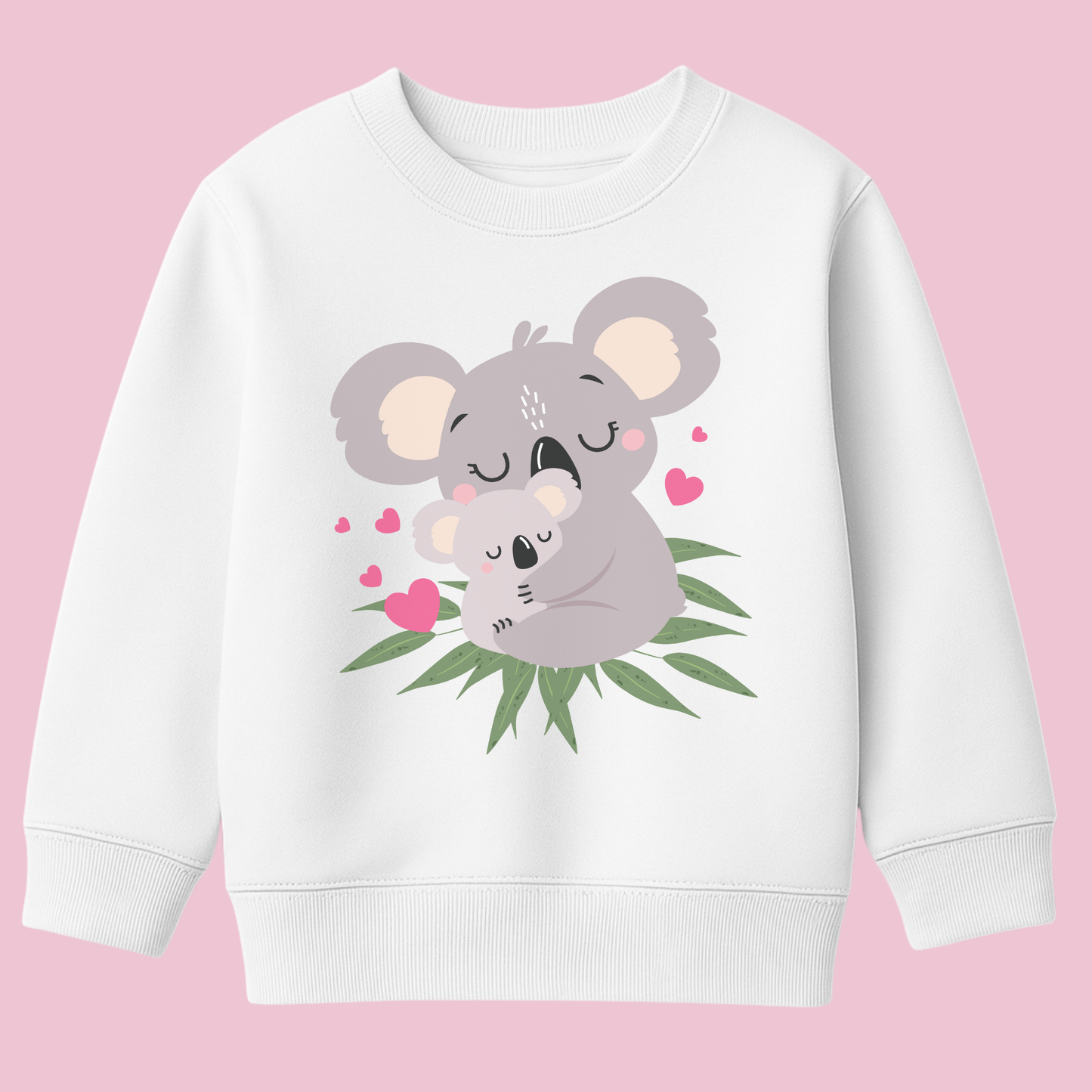 Girls white graphic sweatshirt featuring a cute mother and baby koala cuddling among green eucalyptus leaves, with pink hearts surrounding them.