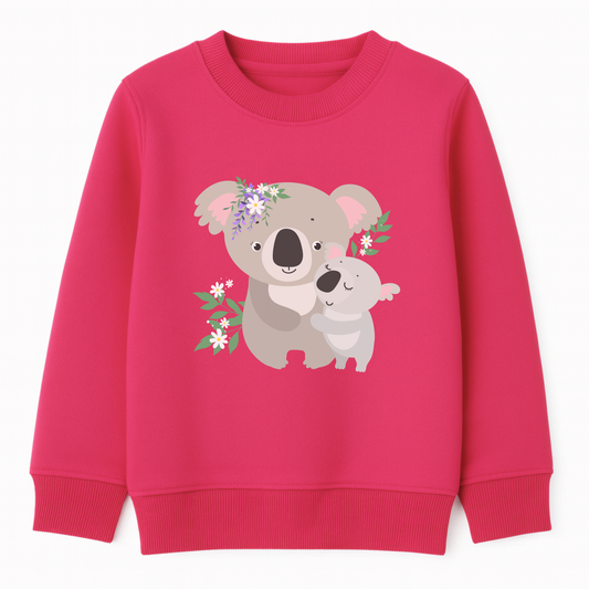 Girls pink sweatshirt featuring a cute mother and baby koala cuddling, surrounded by green leaves and white and purple flowers, printed on the front.