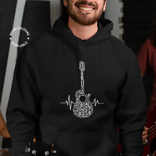 A man wearing a black hoodie with a graphic of an acoustic guitar made of musical notes and a heartbeat line.