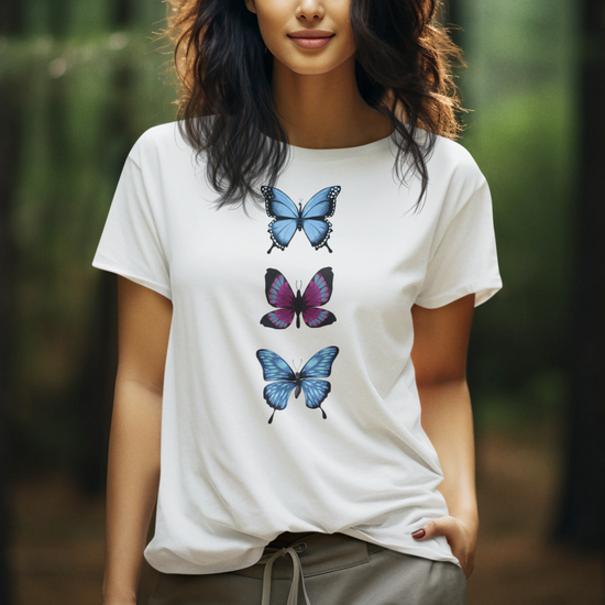 woman wears white short sleeved organic cotton t-shirt with a trio of colourful butterflies