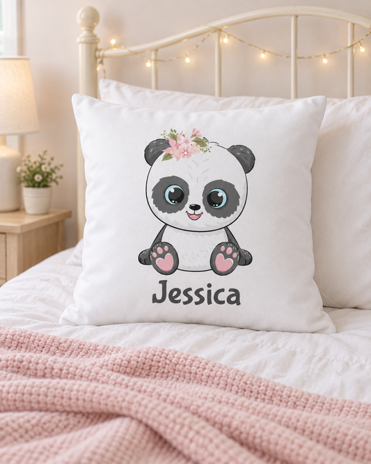 Personalised floral panda cushion with the name Jessica displayed on a cream metal bed with fairy lights
