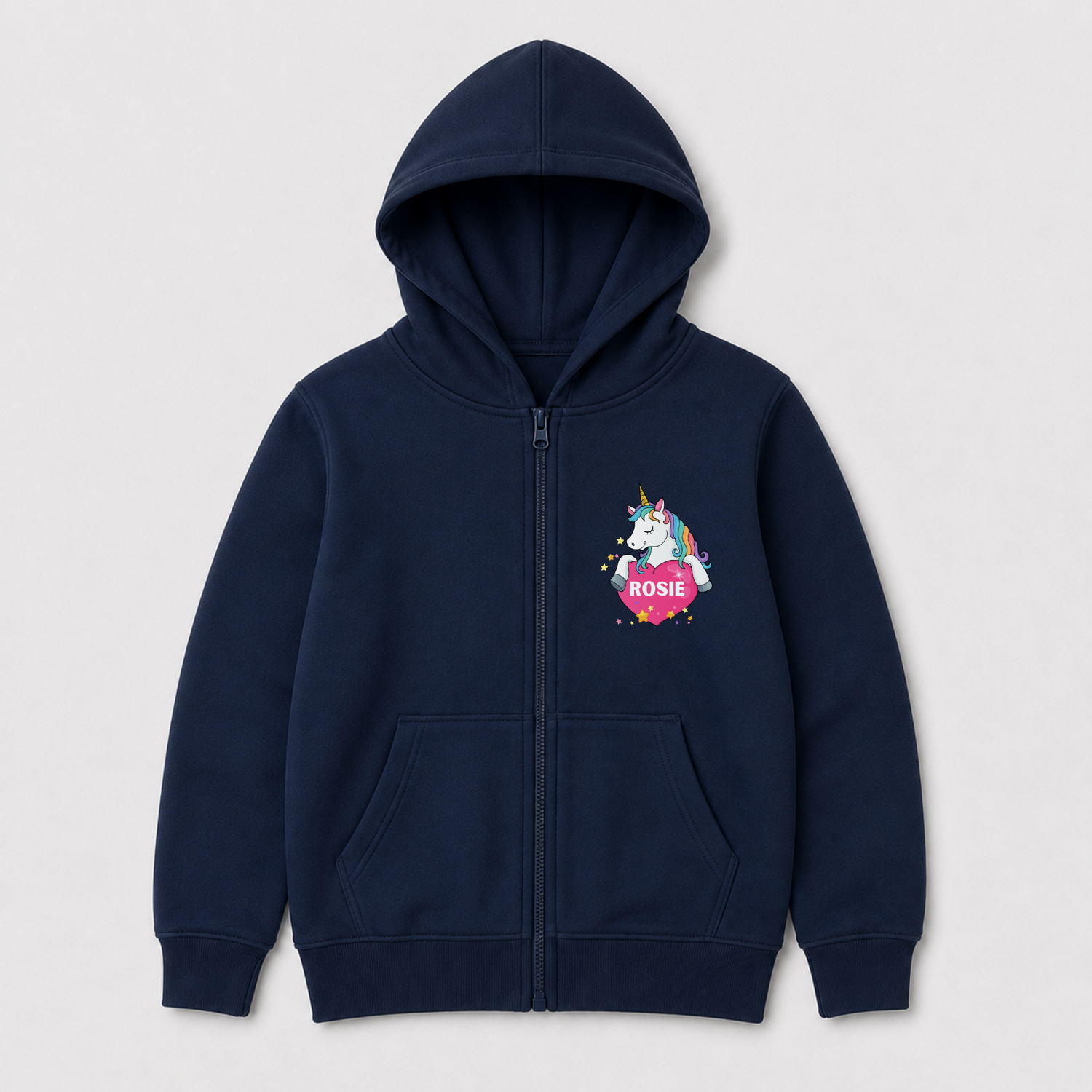 A navy blue zip-up hoodie for kids, featuring a colorful cartoon unicorn graphic on the left chest with a pink heart and the name 'ROSE' written on it, set against a light grey background.
