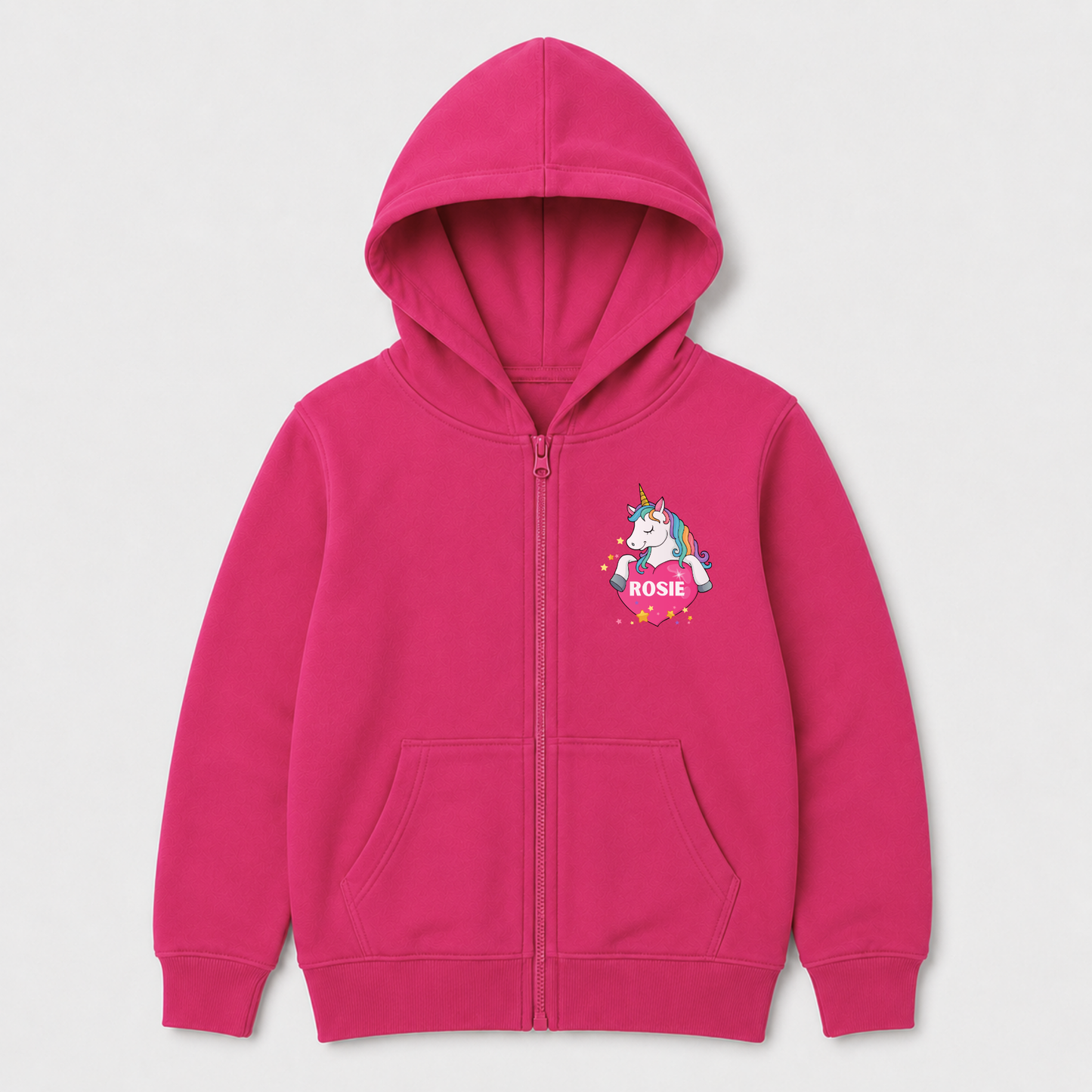 A bright pink zip-up hoodie for kids, featuring a colourful cartoon unicorn graphic on the left chest with the name 'ROSIE' written below it, set against a plain light grey background.