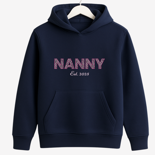 Ladies navy blue hoodie with Leopard print 'NANNY Est. 2025' on a wooden hanger