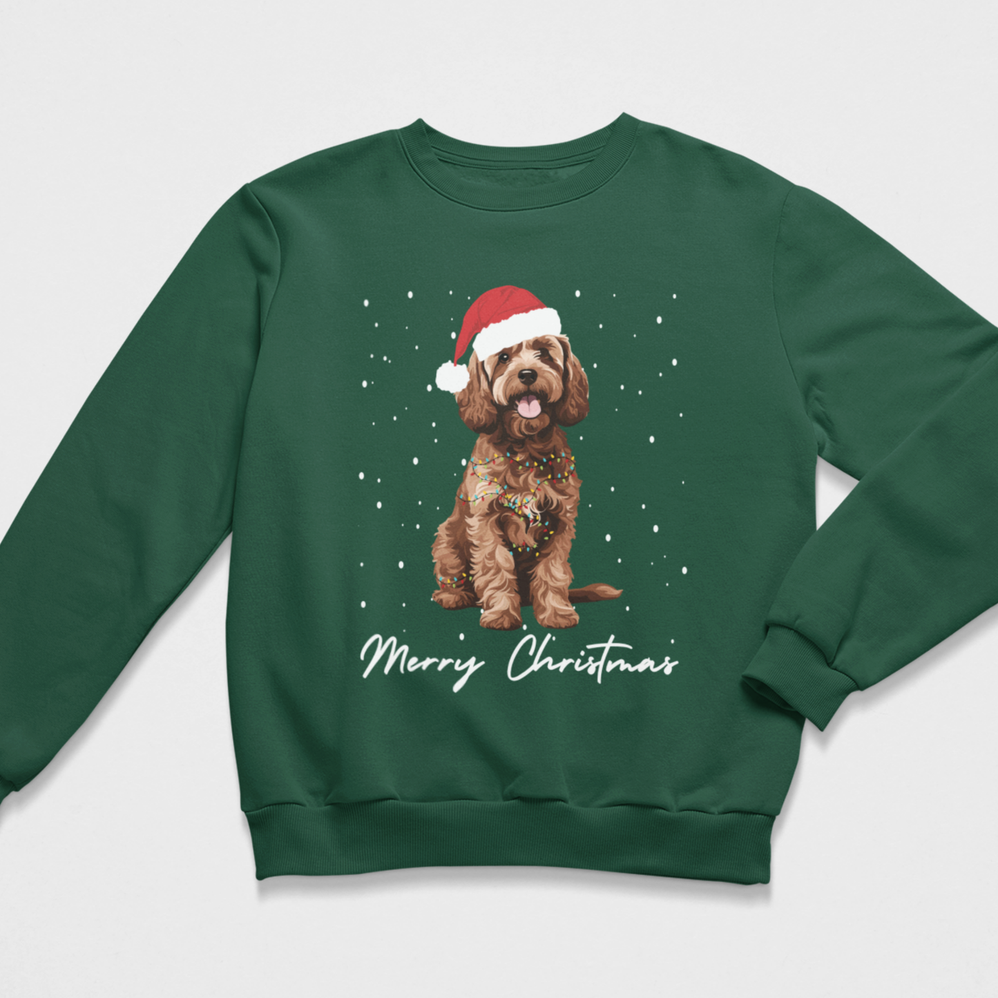 Dark green unisex Christmas jumper featuring a brown Cockapoo in a Santa hat with falling snow and Merry Christmas wording.