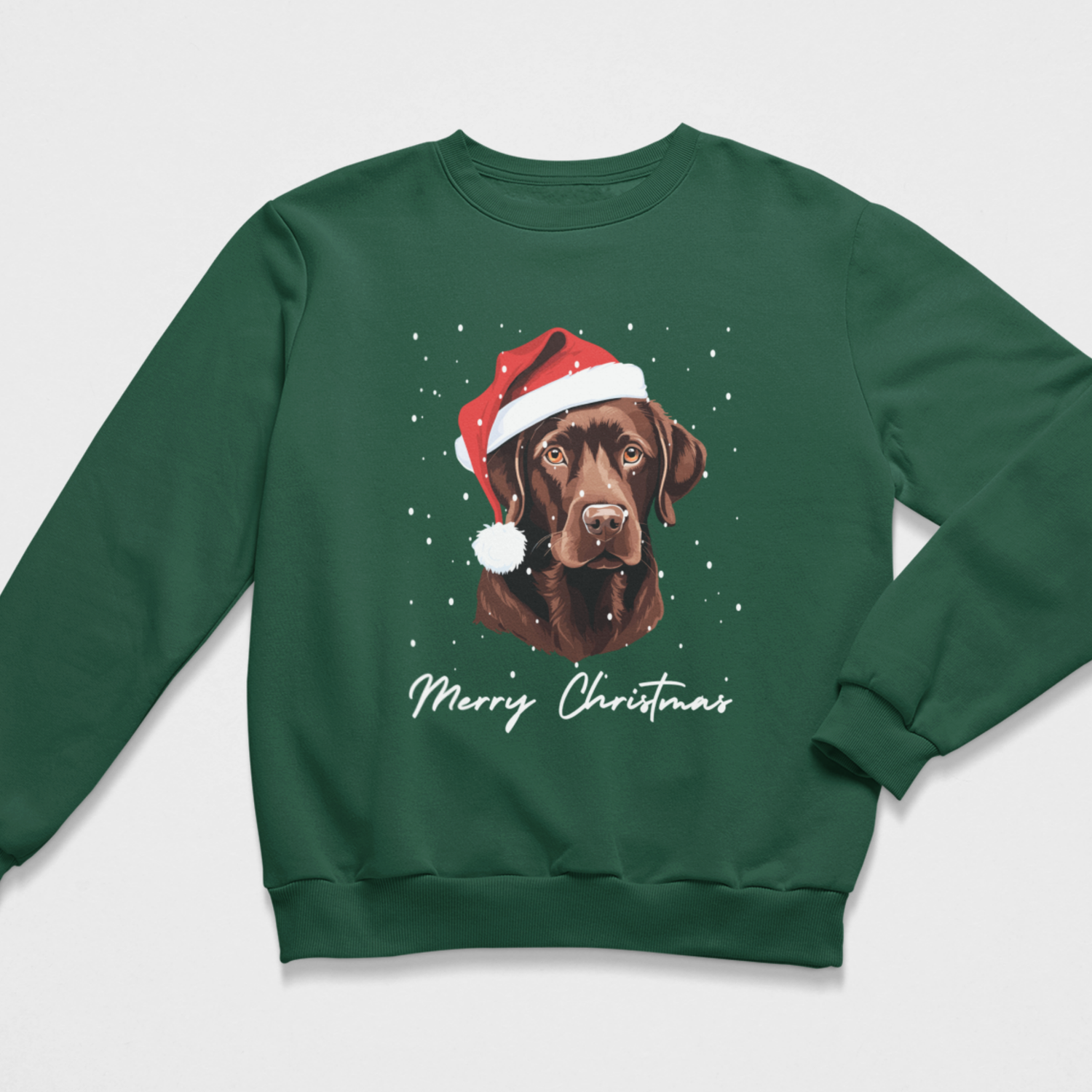 A dark green crewneck sweatshirt featuring a graphic of a chocolate Labrador wearing a red Santa hat with white trim, surrounded by white snowflakes, with 'Merry Christmas' written in white script below.
