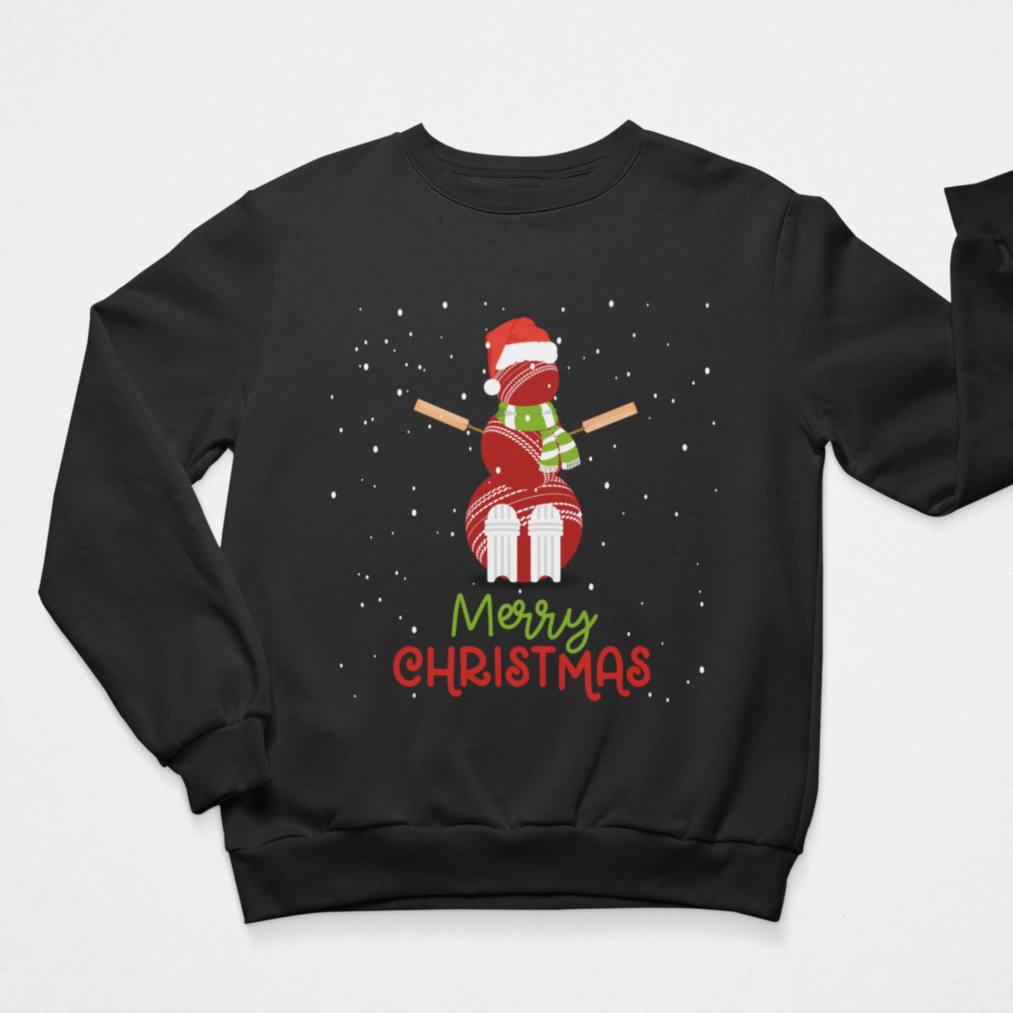 Adults black crewneck sweatshirt featuring a festive Christmas graphic of a snowman made of cricket balls, wearing a Santa hat and scarf, falling snow with the text 'Merry Christmas' underneath on a light grey background.