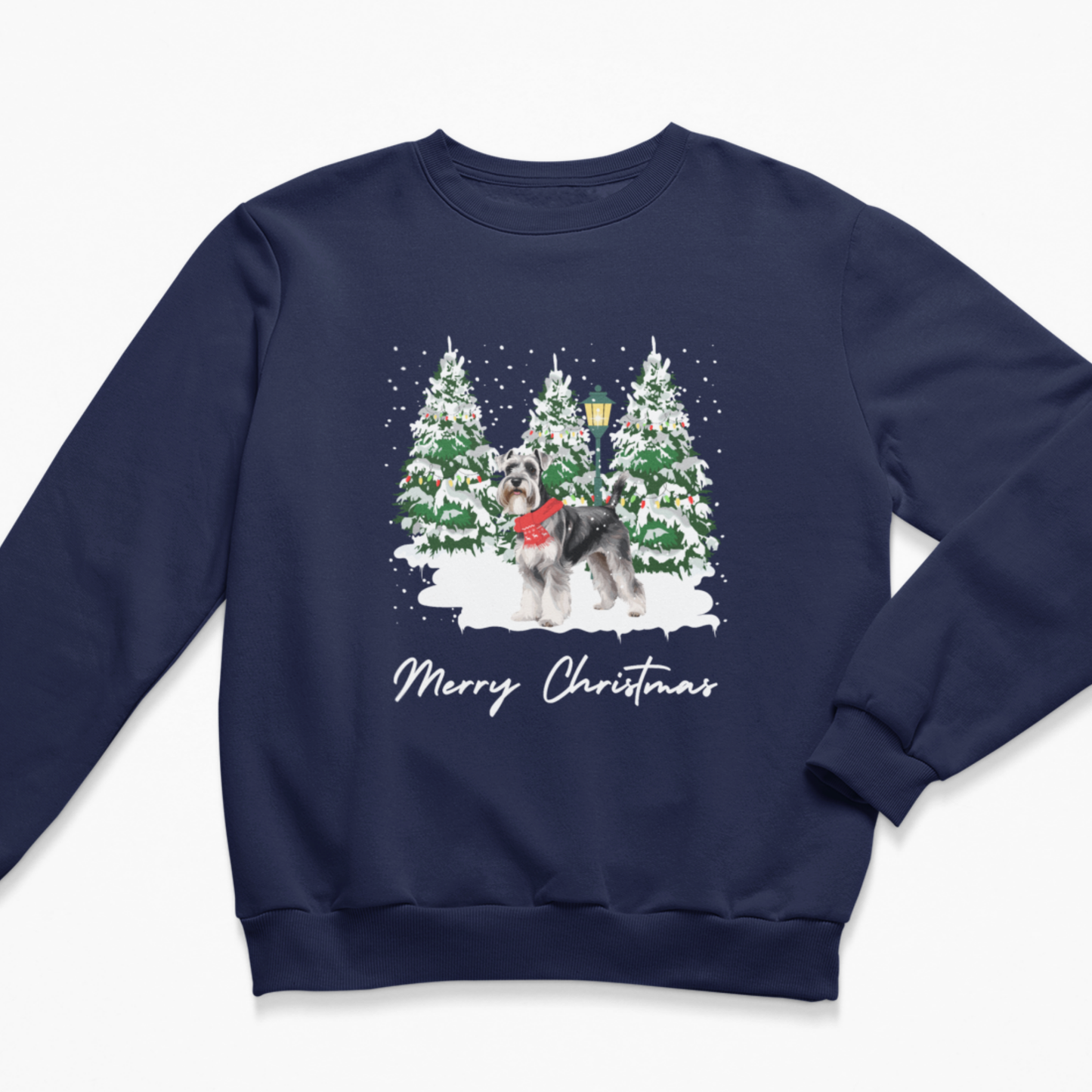 A navy blue crewneck sweatshirt featuring a festive Christmas graphic of a schnauzer in a red sweater standing in front of snow-covered pine trees, with 'Merry Christmas' written below in white script.