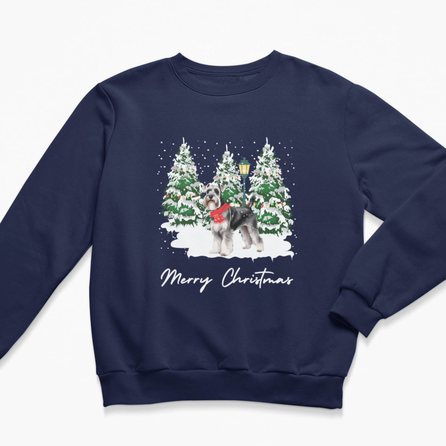 A navy blue crewneck sweatshirt featuring a festive Christmas graphic of a schnauzer in a red sweater standing in front of snow-covered pine trees, with 'Merry Christmas' written below in white script.