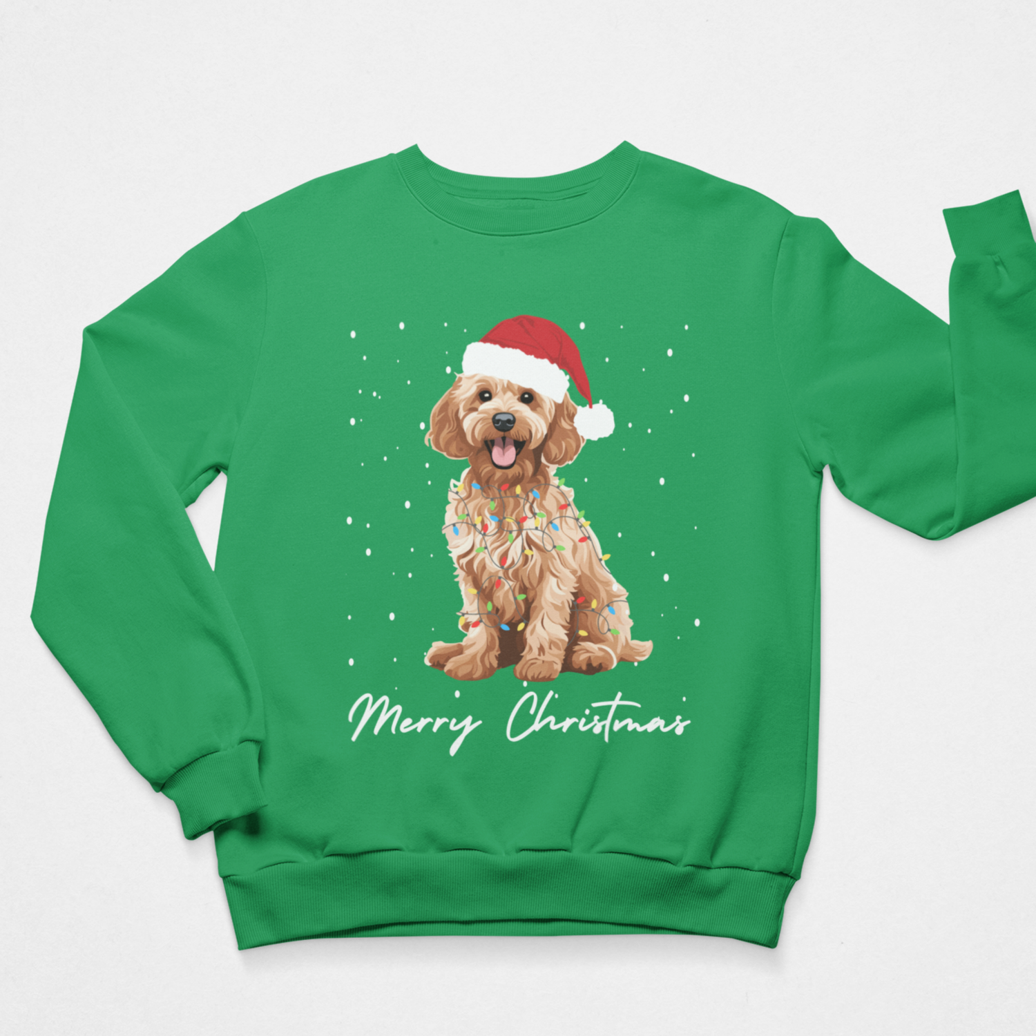 Adults green crewneck sweatshirt featuring a graphic of a golden Cockapoo wearing a Santa hat and a sprinkle-patterned sweater, with 'Merry Christmas' written in white script below. The sweatshirt is displayed flat against a light grey background.