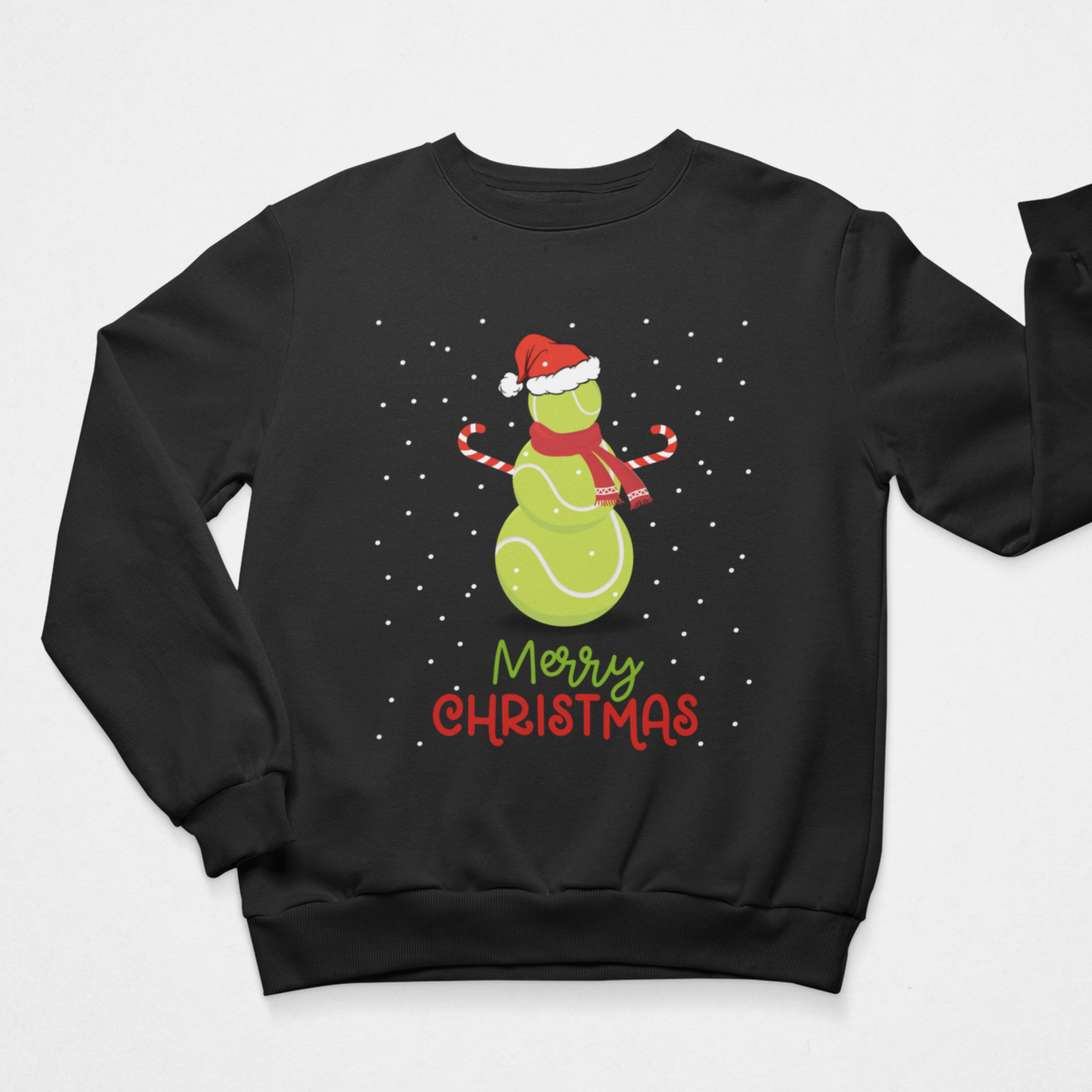 Unisex adults black crewneck sweatshirt featuring a festive Christmas graphic of a green tennis ball snowman wearing a red Santa hat and scarf, surrounded by white snowflakes, with 'Merry Christmas' written below.