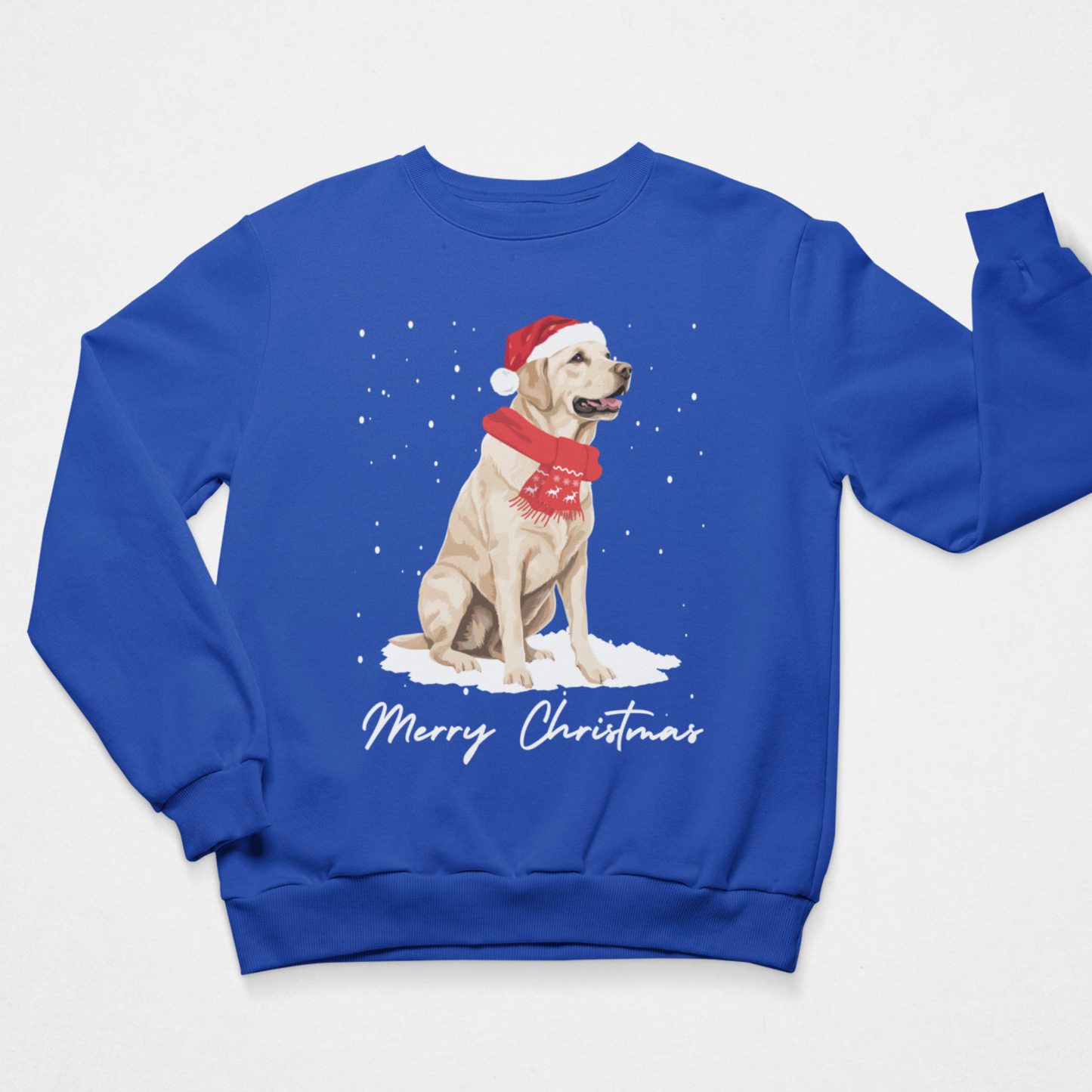 A royal blue crewneck sweatshirt featuring a graphic of a yellow Labrador Retriever wearing a red Santa hat and scarf, sitting in the snow with 'Merry Christmas' written below, displayed on a clean white background.