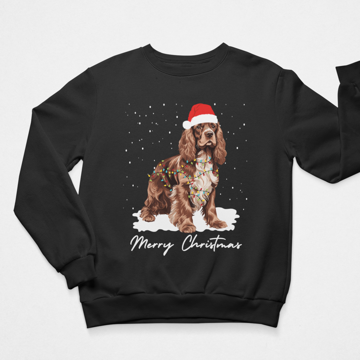 Kids Christmas jumper in black with brown and white Cocker Spaniel in a Santa hat, wrapped in colourful festive lights.