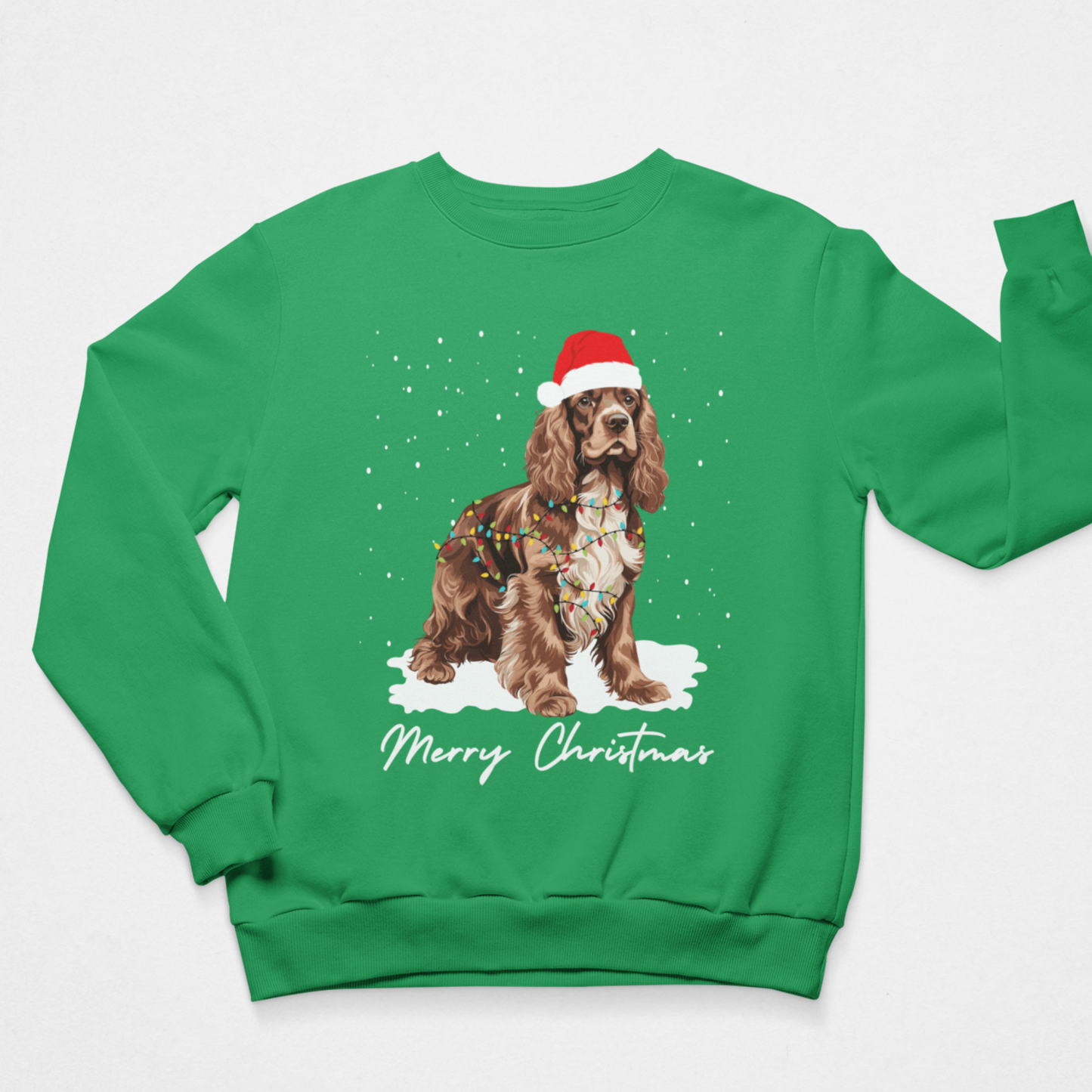 Bright green kids festive jumper with brown and white Cocker Spaniel, Christmas lights, falling snow and Santa hat design.