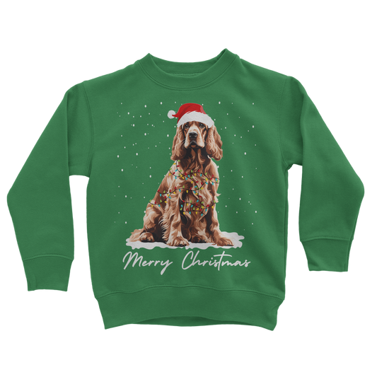 A kids green festive sweatshirt with a graphic of a cocker spaniel wearing a Santa hat and the text 'Merry Christmas'.