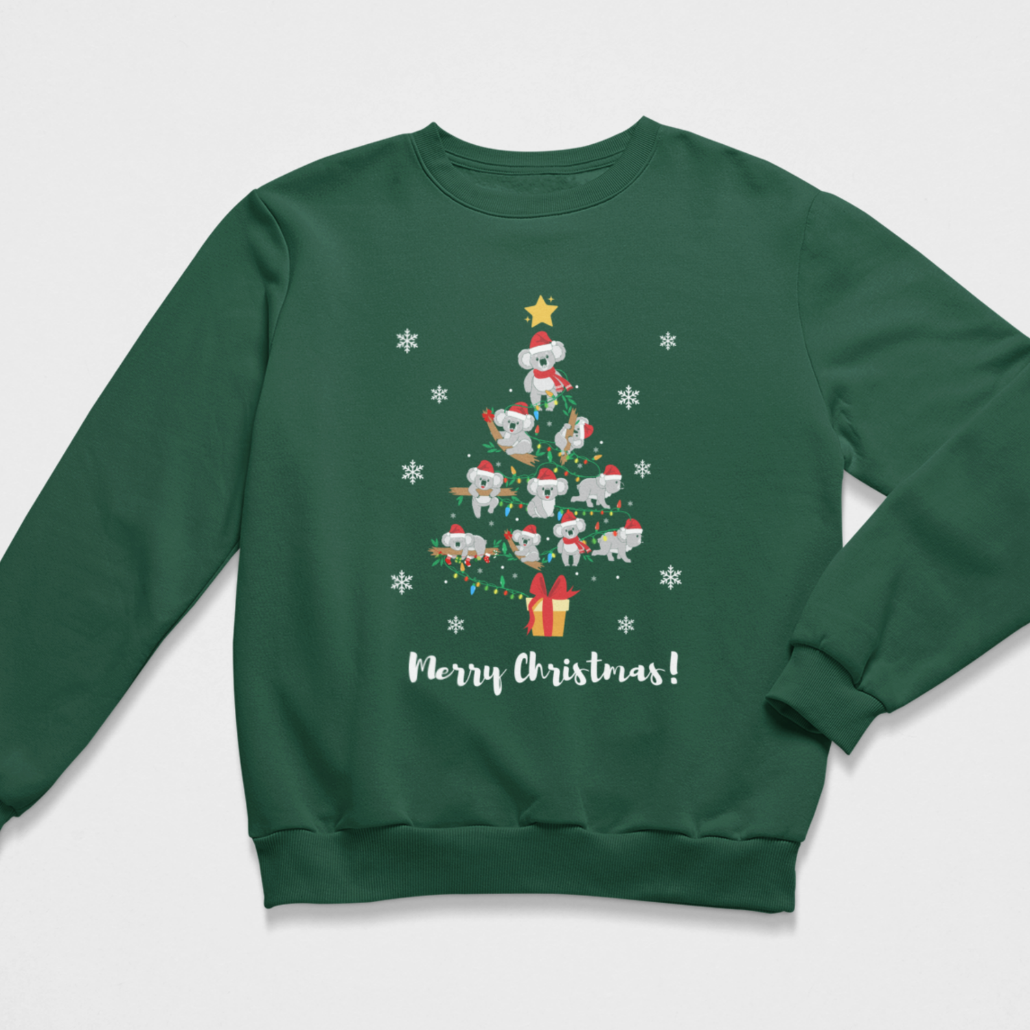 A kids dark green crewneck sweatshirt featuring a festive Christmas tree graphic made of cartoon koalas wearing Santa hats, surrounded by white snowflakes and the text 'Merry Christmas!' printed below.