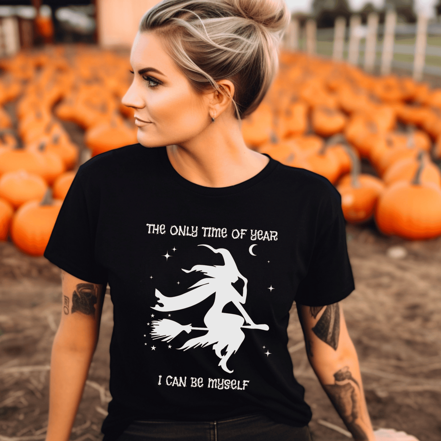 Women's black halloween t-shirt with printed elegant witch on a broom stick design