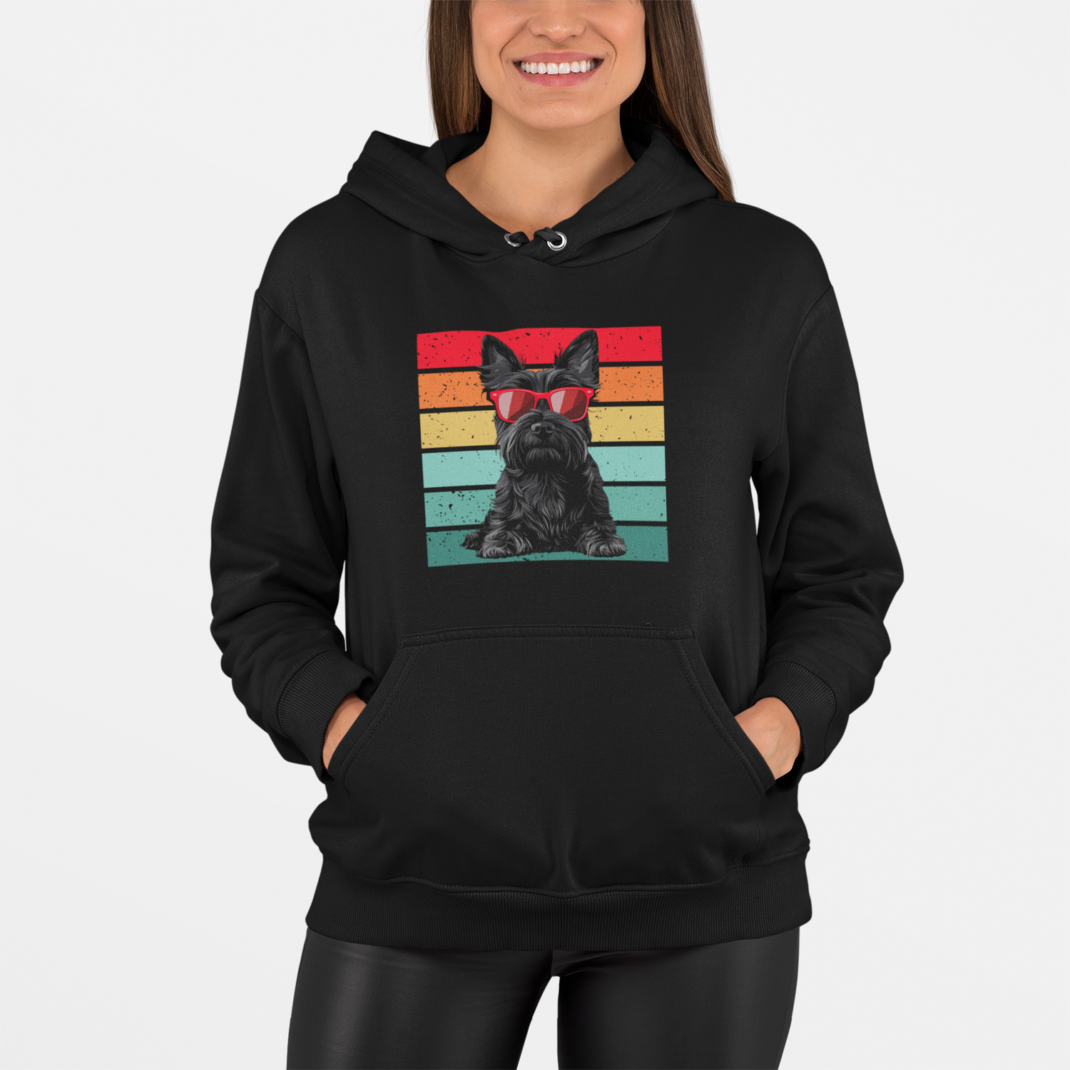 A woman wearing a black hoodie with a scottie dog graphic and retro colourful background.