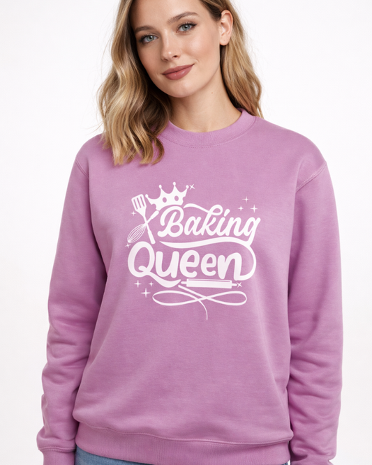 Front view of lavender Baking Queen sweatshirt with white baking graphic and crown – women’s baking themed sweater.
