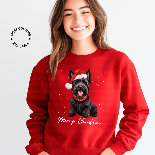 A woman wearing a red Christmas sweatshirt with a scottie dog design and 'Merry Christmas' text.
